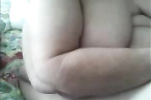 My aged chunky white wife pleases herself with fingering indoors