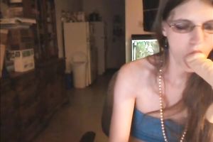 Four eyed web camera slutwife sucks her sextoy in front of her webcam