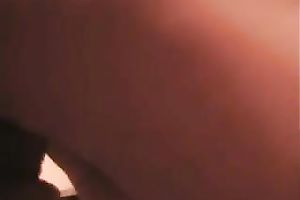 Lewd woman copulates her arsehole with a large sex-toy in solo scene