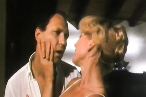 Retro blond in underware makes out with a guy and sucks his prick