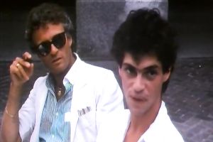 Retro blond in underware makes out with a guy and sucks his prick