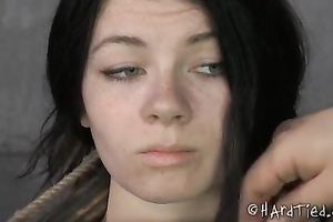 Sexy brunette hair hottie with pale skin brutally restricted by her dominant
