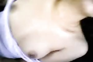 Pretty gal sucks her BF's wang in a car and lets him touch her love melons