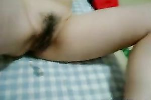 Asian whore sucks a cock and rubs it against her hirsute cum-hole
