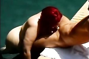 Redhead white older obese white wife by the pool is engulfing shlong
