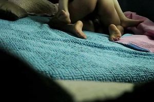Hidden webcam in the bedroom films how a stud bonks Asian BBC slut