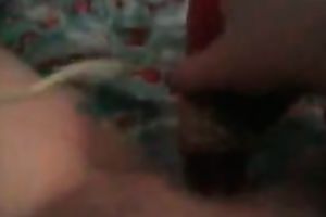 Sexy wench with phone in one hand and marital-device in the other one