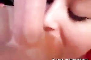 Provocative dark brown sweetheart sucks hard penis and licks balls