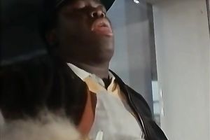 Two retro bitches share a dark dwarf's ramrod on a sofa