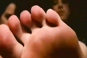Playful Latin students boast with their slender pedicured feet