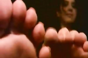 Playful Latin students boast with their slender pedicured feet