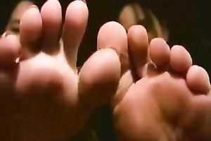 Playful Latin students boast with their slender pedicured feet