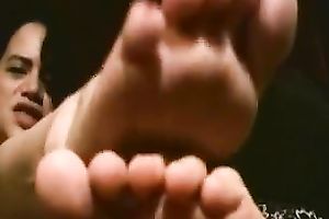 Playful Latin students boast with their slender pedicured feet