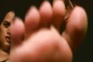 Playful Latin students boast with their slender pedicured feet