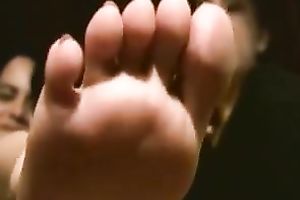 Playful Latin students boast with their slender pedicured feet