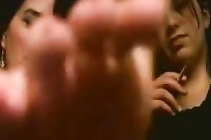 Playful Latin students boast with their slender pedicured feet
