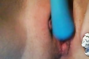 My alluring paramour fingers and toys her yummy twat indoors