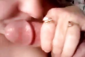 She wipes and widens cum all over her large natural tits