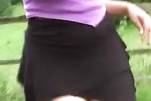 My white women entertains herself by toying her fur pie outdoors