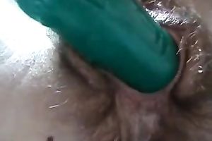 My aged white lady entertains herself by toying her unshaved fur pie