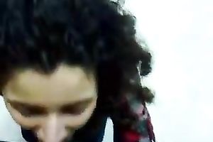 Curly haired cutie sucks her lover's shaft and licks his balls like crazy