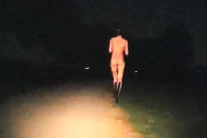 Kinky floozy strips in the midst of the street at night