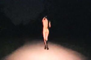 Kinky floozy strips in the midst of the street at night