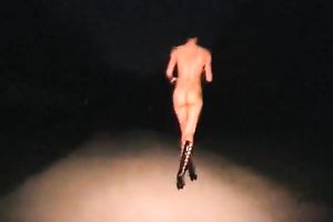 Kinky floozy strips in the midst of the street at night