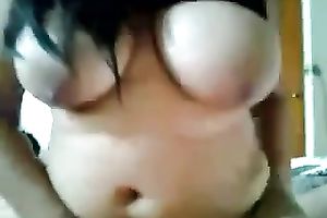 Raven-haired co-worker rides my knob after sucking it ardently