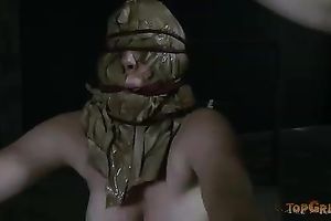 Bosomy doxy with a bag on her face is bounded with ropes and tortured