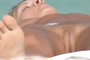 This excited playgirl on the beach is meant to be stripped