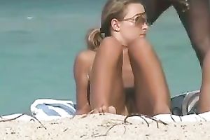 This excited playgirl on the beach is meant to be stripped