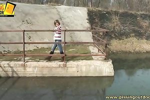 Naughty Married slut with bald cookie urinates near the river