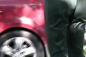 Long-haired slut Olga pees her trousers in the street