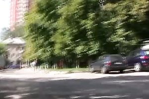 Long-haired slut Olga pees her trousers in the street