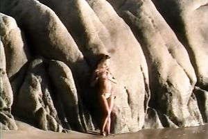 Breath-taking chick Racquel posing undressed on a beach