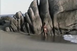 Breath-taking chick Racquel posing undressed on a beach