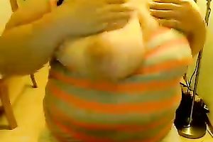 This obese charmer enjoys showing off her giant saggy titties