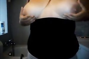 This bulky whore can't live without playing with her large adorable boobies