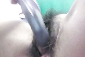 Horny legal age teenager copulates her curly vagina and anus with a rabbit sextoy