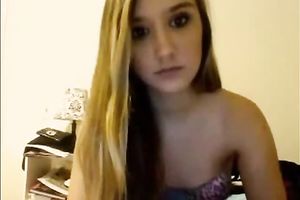Blonde teenage sweetie talks on livecam and takes all her raiment off