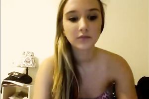 Blonde teenage sweetie talks on livecam and takes all her raiment off