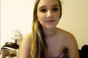Blonde teenage sweetie talks on livecam and takes all her raiment off