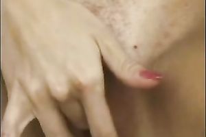 Mesmerizing golden-haired chick outdoors fingering herself