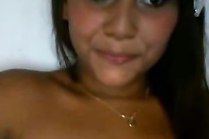 Latina babe with jet dark hair flashes her breasts and fur pie