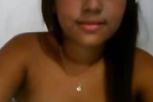 Latina babe with jet dark hair flashes her breasts and fur pie