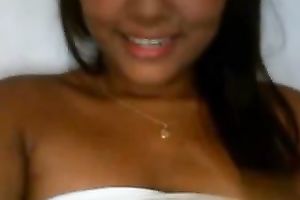 Latina babe with jet dark hair flashes her breasts and fur pie