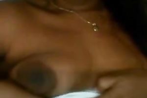 Latina babe with jet dark hair flashes her breasts and fur pie