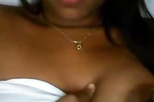 Latina babe with jet dark hair flashes her breasts and fur pie