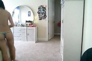 Shapely dark brown enchantress shows off her well-shaped butt